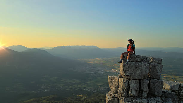 istock Hiker on Rocky Peak at Sunrise, Overlooking Valley 2245907909