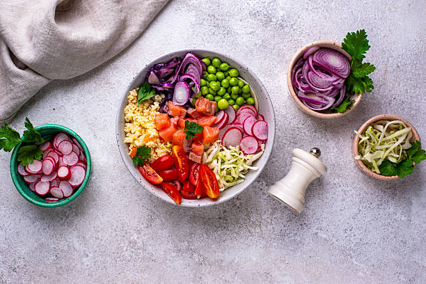 istock Balanced healthy bowl with vegetables and salmon 2245908577