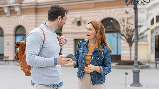 istock Cheerful Couple Discussing Plans in City Area 2245909199