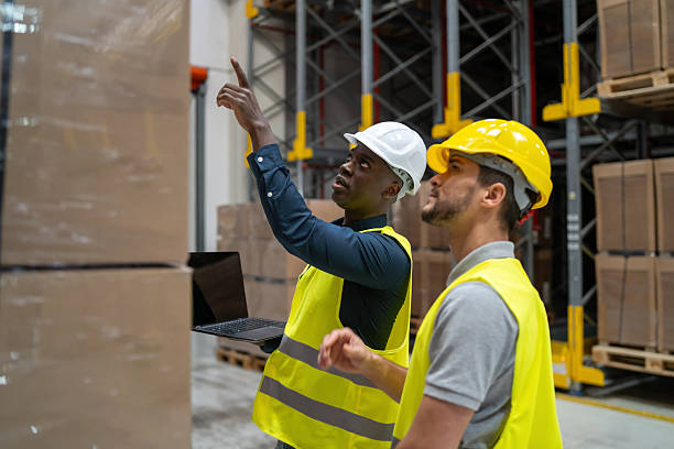 istock Warehouse Team Reviewing Inventory with Digital Tools 2245909235