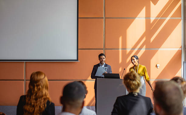istock Presenters Engaging Audience During Business Conference Presentation 2245909303