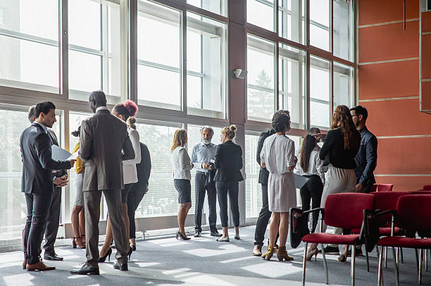 istock Diverse Executives Networking at a Business Conference Event 2245909329