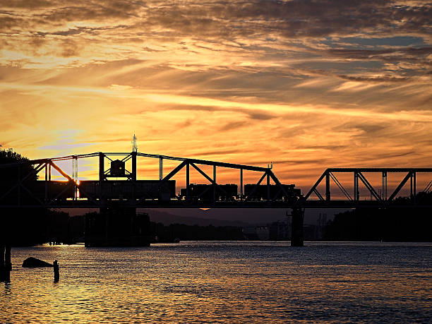 Train crossing bridge over river