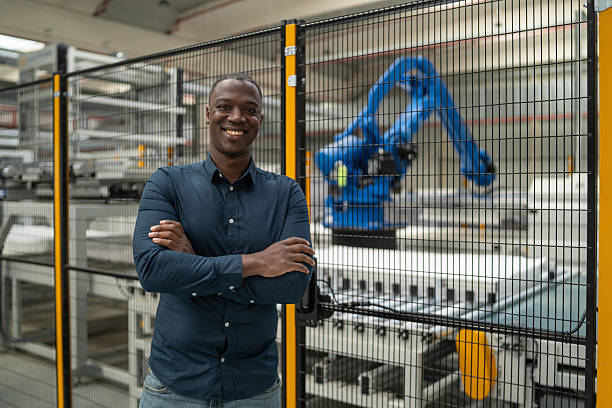 istock Smiling Professional in Factory Showcasing Enthusiasm 2245912969