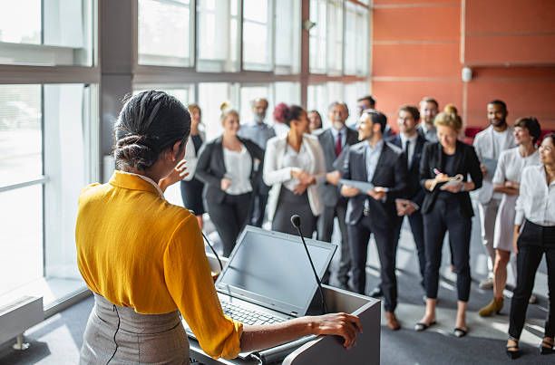 istock Young Indian Businesswoman Presenting at Conference With Engaged Audience 2245912980