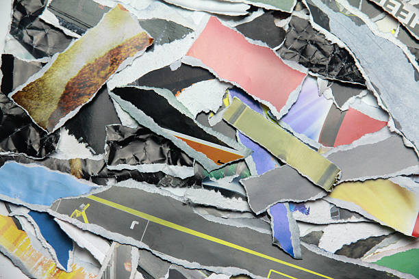 istock Multicolored poster paper, torn into numerous pieces. 2245913047