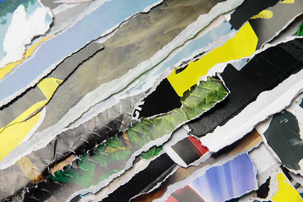 istock Multicolored poster paper, torn into numerous pieces. 2245913048