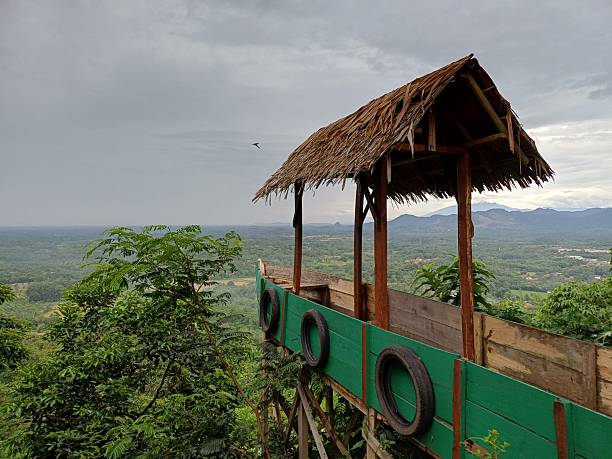 istock Wooden Boat-Shaped Viewpoint Overlooking Green Valley and Mountains 2245915152