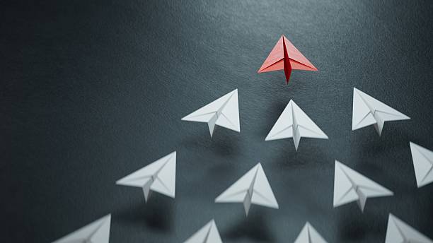 istock winner red paper plane. new ideas. paper art style. creative idea.3D rendering on black background. 2245915250