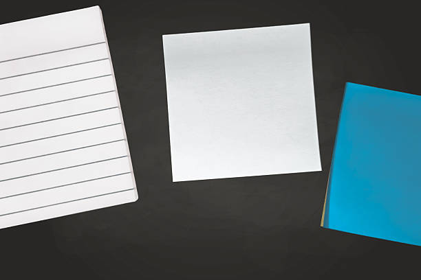Blank ruled paper and sticky notes background banner isolated on slate blackboard with clean horizontal lines for text overlays, ideal for education or office projects.