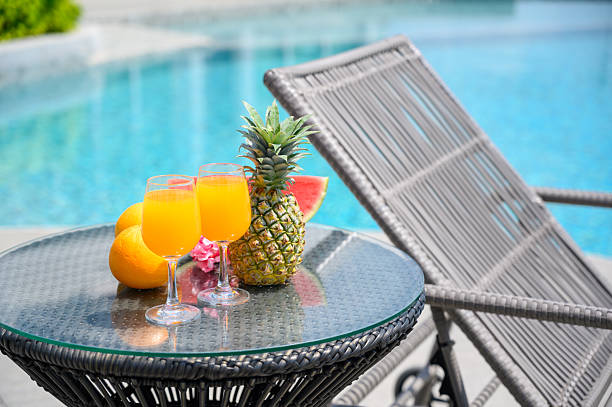 istock Refreshing tropical drinks and fruits by the poolside, perfect for summer vacation and relaxation. 2245922708