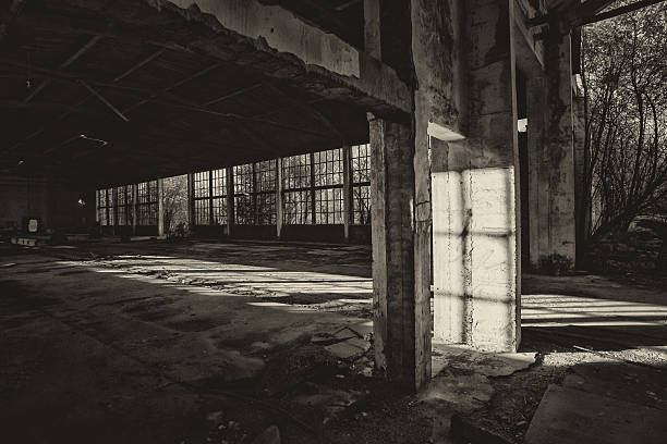 Spooky haunted abandoned building on a sunny autumn day.
