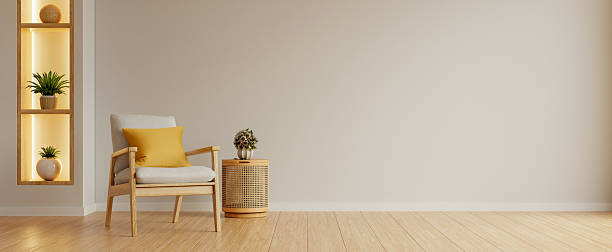 istock A minimalist interior design banner with an empty bright beige wall mockup, a cozy wooden armchair with a yellow cushion- 3D rendering 2245923396