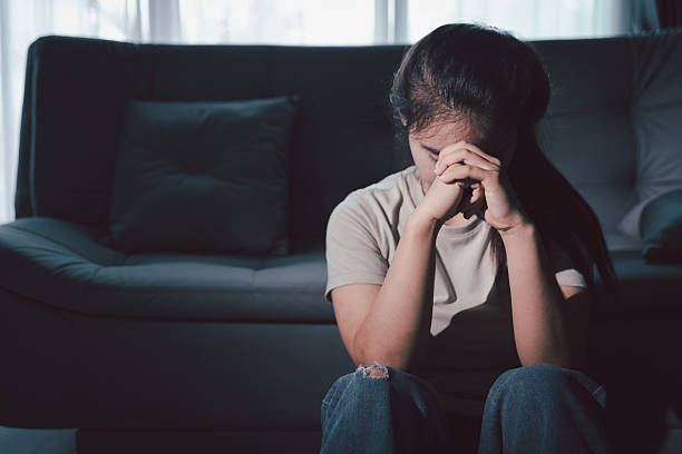 istock Sorrowful woman sat alone, overwhelmed by emotion, her sad and unhappy expression revealing deep despair, stress and distress left feeling depressed. sorrowful sad, despair alone, depressed stress 2245926416