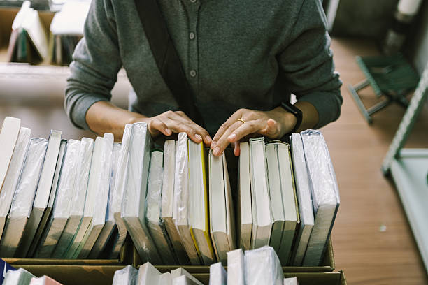 istock An Asian woman is in a second-hand bookstore, choosing second-hand books, second-hand stores, recycling stores, and eco-friendly stores 2245926805