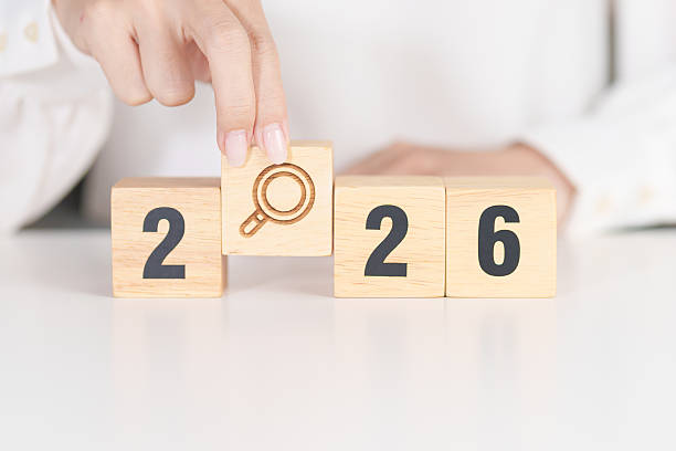istock 2026 year block with magnifying glass icon. SEO, Search Engine Optimization, hiring , Advertising, Idea, Strategy, marketing, Keyword, Content and New Year start concepts 2245927812