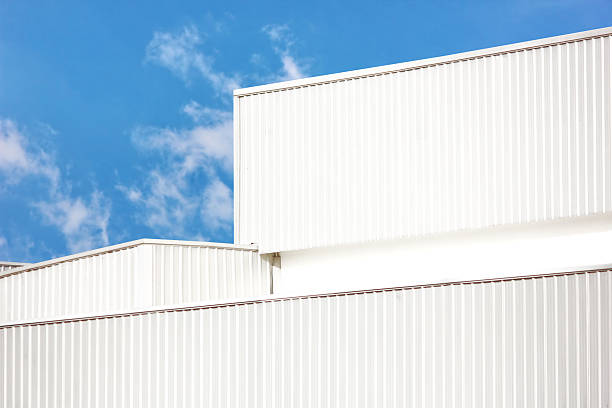 istock architecture design square shape corrugated wall geometric buiding. The factory warehouse is exterior decorated with corrugated texture to create a point of interest with beautyl 2245932322