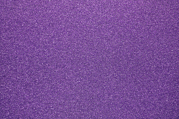 istock Purple glitter textured paper showing gleaming particles, suitable for festive, celebration, or luxurious concepts 2245933445