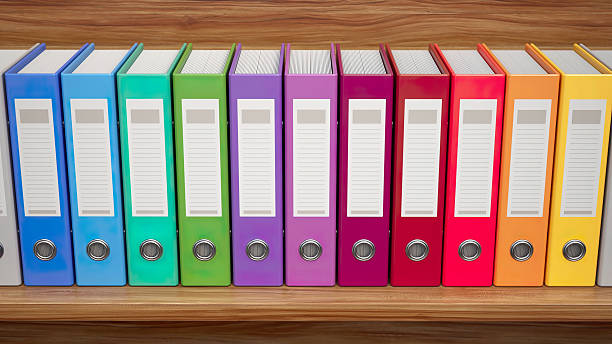 istock Organizing office files with colorful binders for better productivity and efficiency at work 2245933729