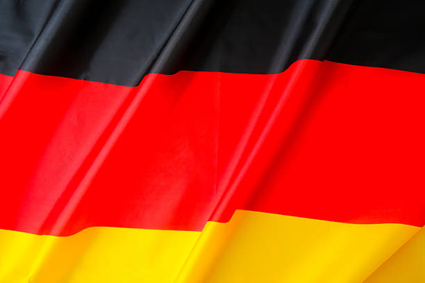 National symbol of Germany. German full framed wave Germany fabric flag background. Copy space for your text. Concept of Independence