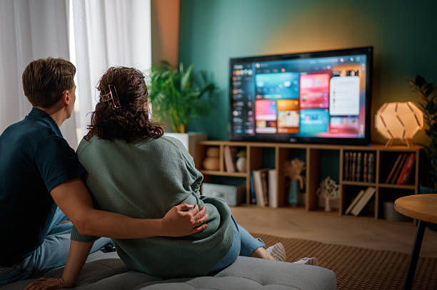 istock family watching  TV at home 2245941193