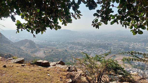 istock Hazy Elevated View Over Arid Valley Town Landscape 2245942835