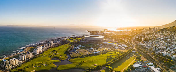 Sunrise in Sea Point with the stadium and V & A Waterfront in the distance.