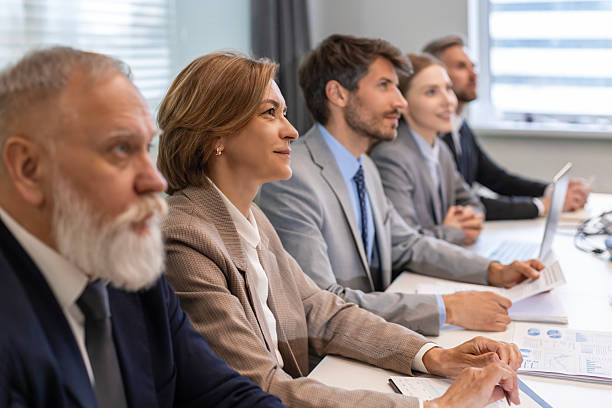 istock Row of business people working at seminar 2245942981