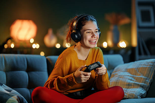 istock woman is playing video game 2245943463