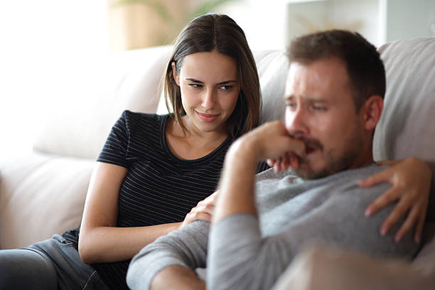 istock False bad friend happy to see her sad mate 2245944909