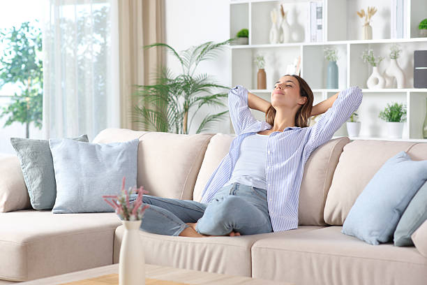 istock Woman in blue relaxing and resting on a couch 2245945002