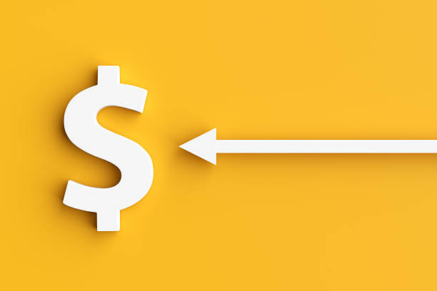 istock White arrow pointing to a dollar symbol on yellow background 2245945413
