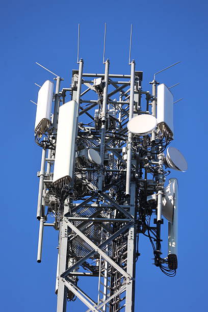 istock Telecommunication tower with antennas against blue sky 2245949575
