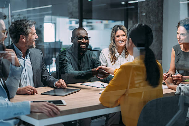 istock Businesspeople shaking hands across the table. 2245951360