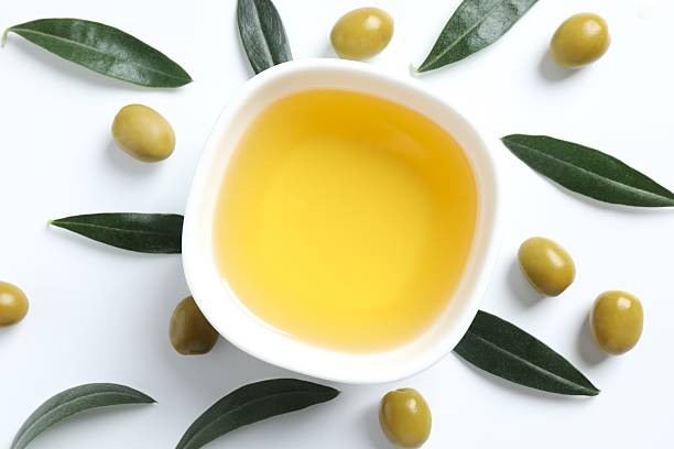 istock Ffresh olive oil and olives close-up 2245952740