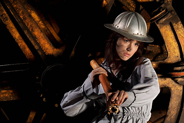 Steampunk and retro style. Attractive vintage woman with stylish accessories on dark background. Fashionable female portrait.