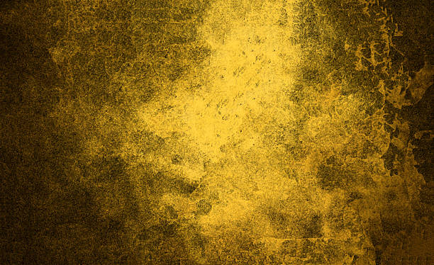 istock Abstract yellow grunge textured background with gold effect 2245953136