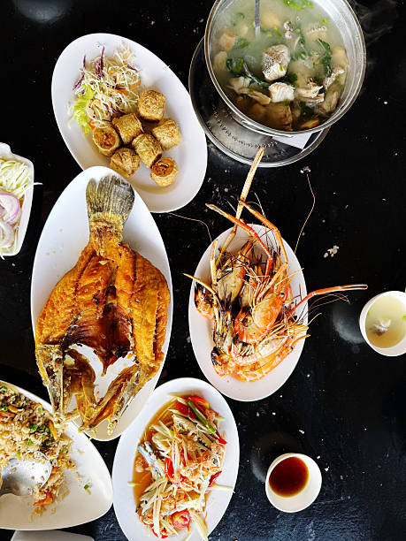 istock Fried fish with rice on black table, Thai style food. 2245953254