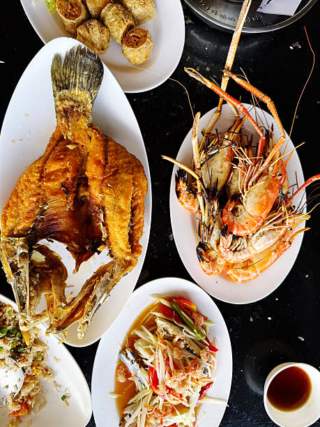 istock Fried fish with rice on black table, Thai style food. 2245953882