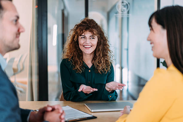 istock Group of business persons talking in the office. 2245953899