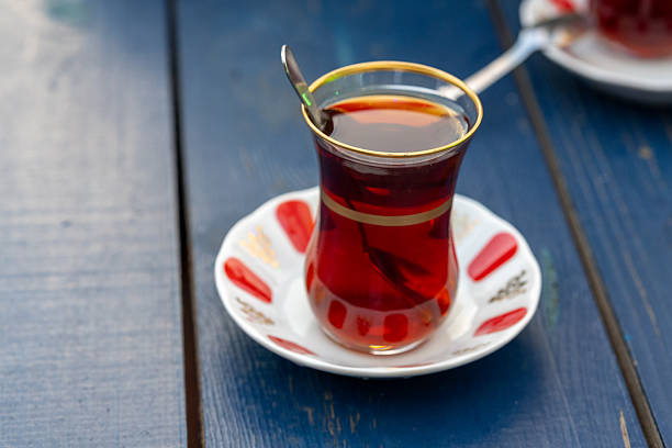 Turkish tea in a glass cup in close-up in slow motion