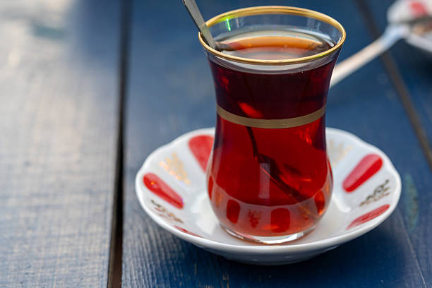 Turkish tea in a glass cup in close-up in slow motion