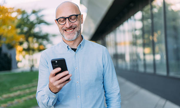 istock Businessman texting outdoors. 2245956362