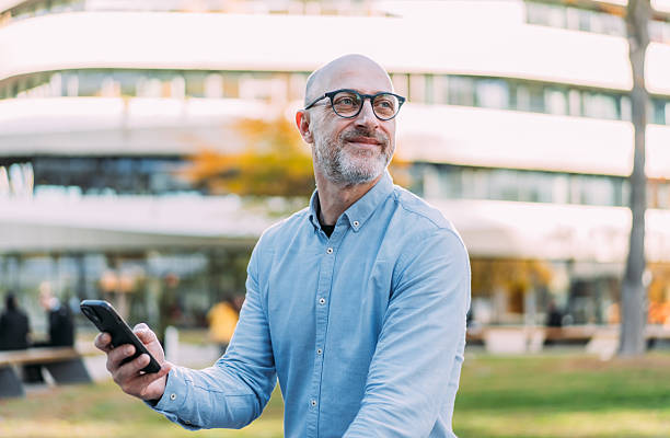 istock Businessman texting outdoors. 2245956365