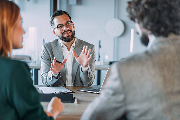 istock Group of business persons talking in the office. 2245956571