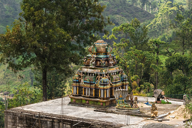 istock Colorful Hindu Temple Structure on Rooftop Amidst Sri Lankan Greenery 2245957630
