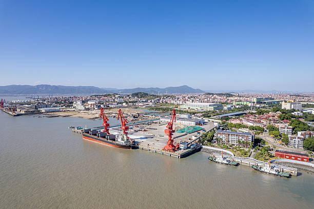 istock Cranes at the cargo port are loading materials onto a cargo ship. 2245961205