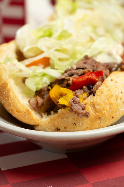 istock Sandwich with cheese steak, salad, potatoes, bacon and sauce 2245963531