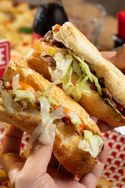 istock Sandwich with cheese steak, salad, potatoes, bacon and sauce 2245963579
