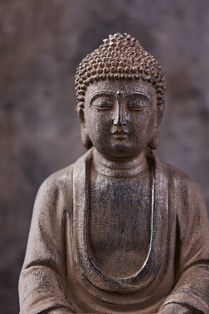 istock Meditating Buddha Statue on dark background. Soft focus. Close up. Copy space. 2245966023